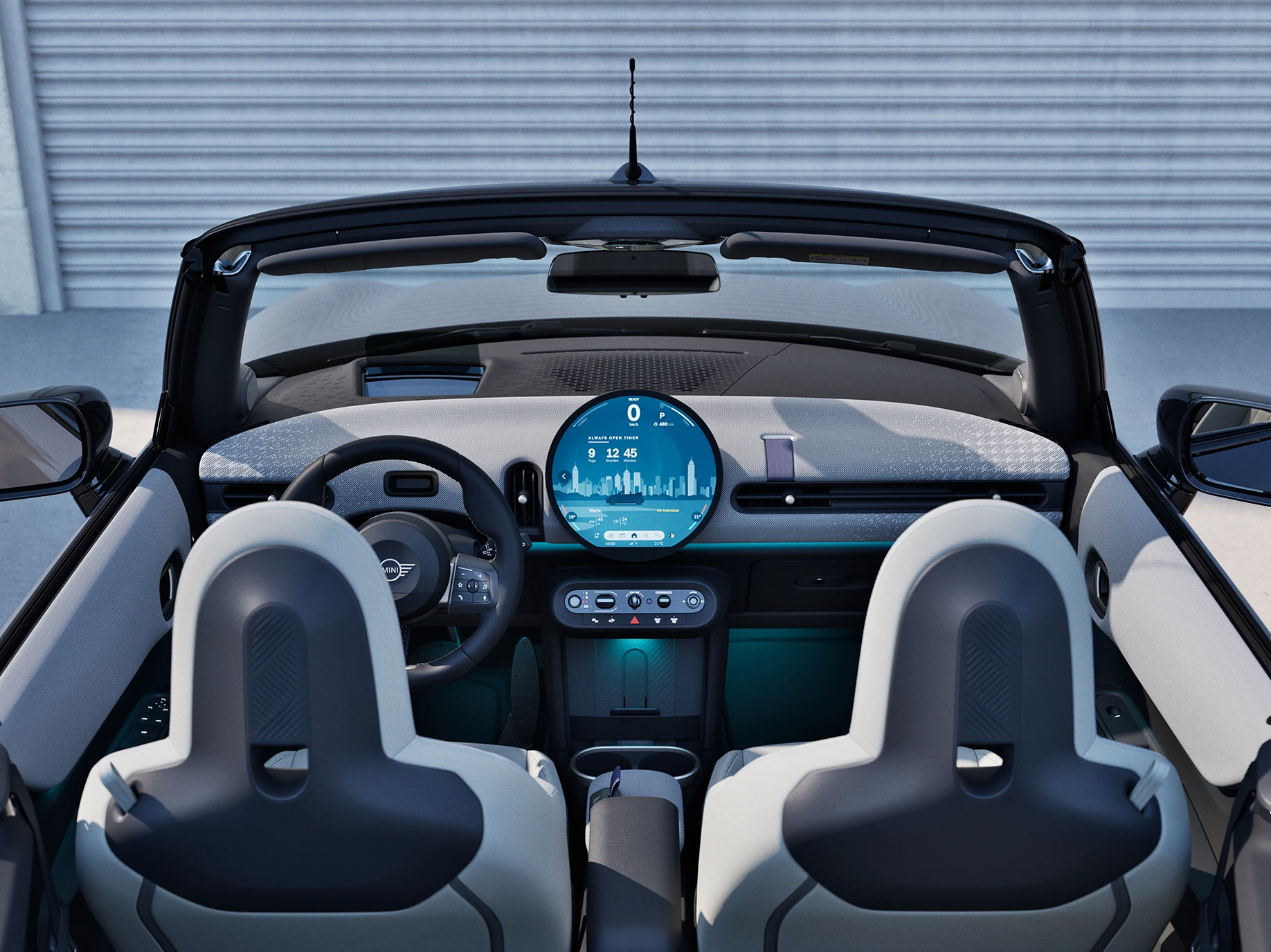 Rear view of the MINI Cooper Convertible interior with focus on the dashboard and the interaction unit.